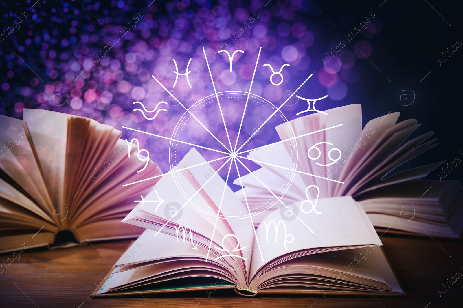Image of Open books on wooden table and illustration of zodiac wheel with astrological signs
