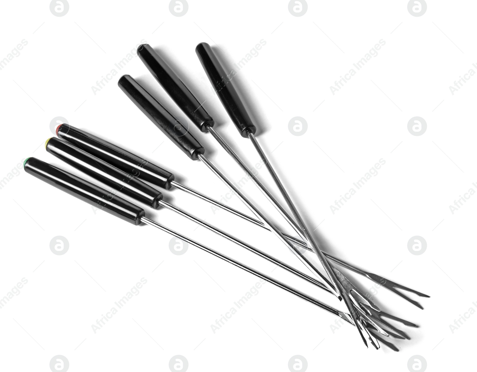 Photo of Set of fondue forks on white background. Kitchen equipment