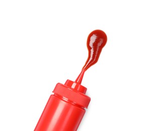 Photo of Squeezed ketchup from red bottle isolated on white, top view