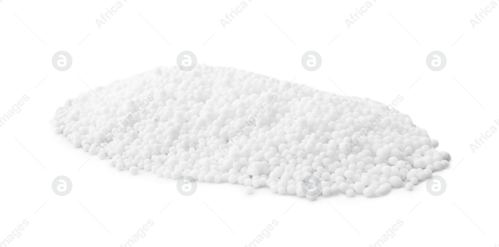 Photo of Pellets of ammonium nitrate on light grey background. Mineral fertilizer