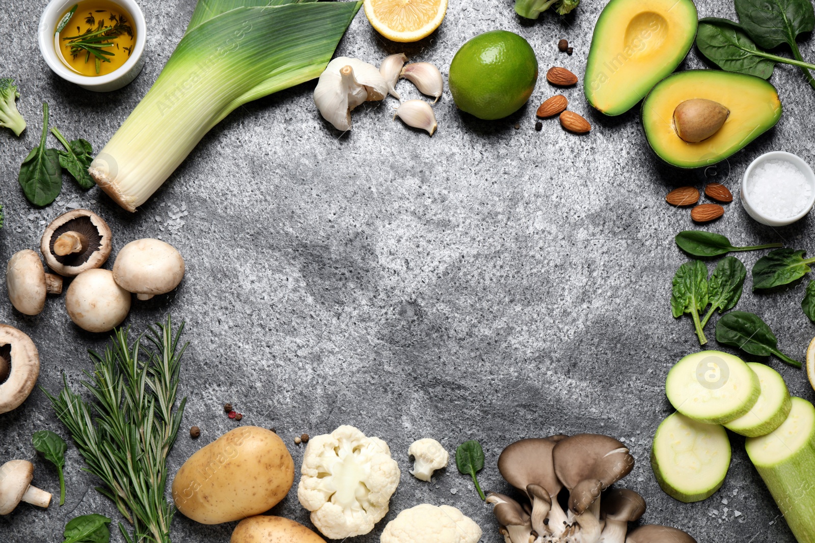 Photo of Flat lay composition with fresh products on grey table, space for text. Healthy cooking