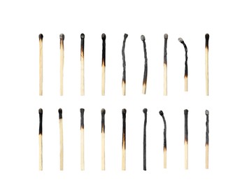 Image of Set with burnt matches on white background