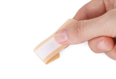 Photo of Woman with medical adhesive bandage isolated on white, closeup