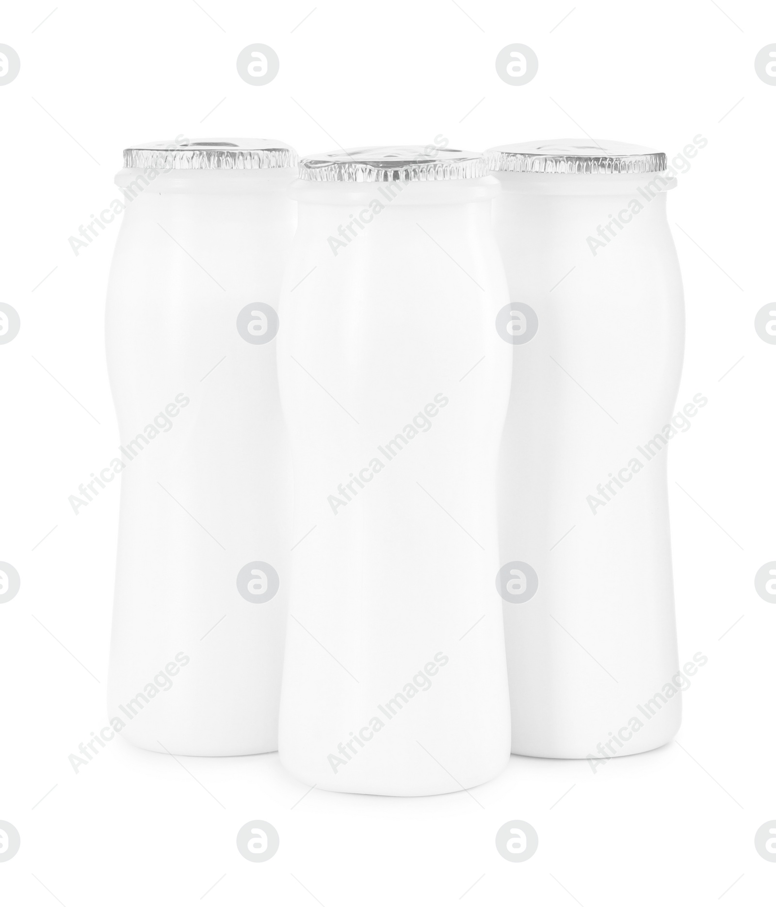 Photo of Tasty yogurt in bottles isolated on white