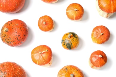 Photo of Flat lay composition with orange pumpkins on white background. Autumn holidays