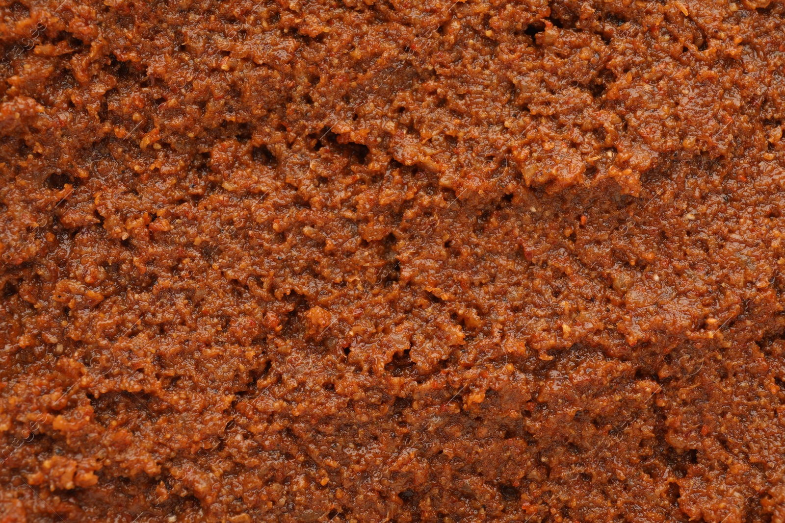 Photo of Texture of delicious adjika sauce as background, closeup