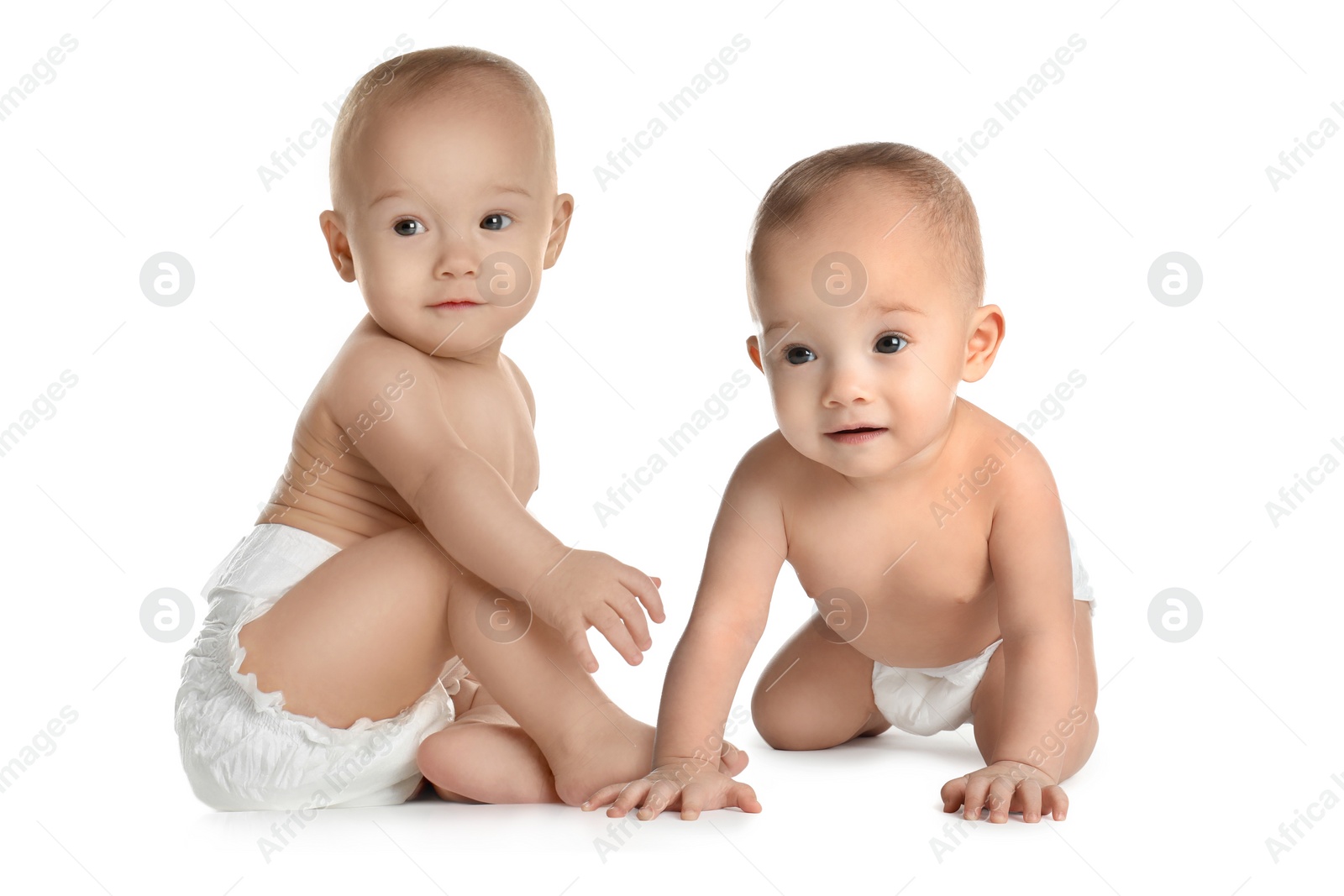 Image of Portrait of cute twin babies on white background