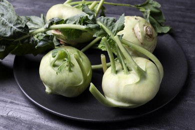 Whole ripe kohlrabi plants on grey table