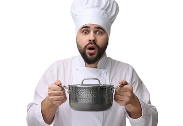 Photo of Surprised young chef in uniform holding cooking pot on white background