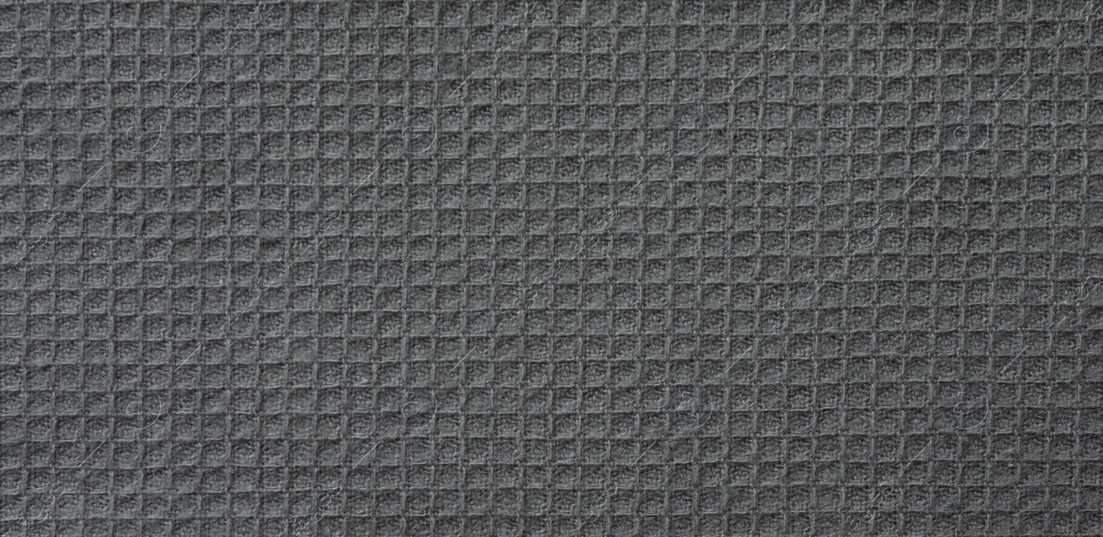 Photo of Texture of grey knitted fabric as background, top view