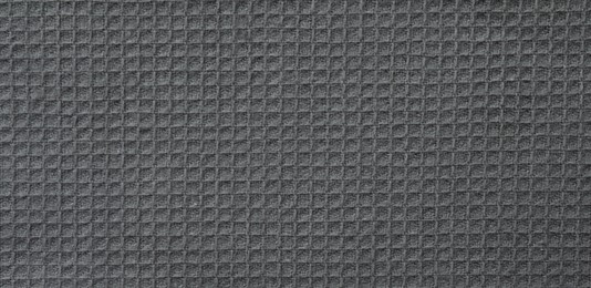 Texture of grey knitted fabric as background, top view