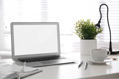 Modern laptop on office table. Stylish workplace