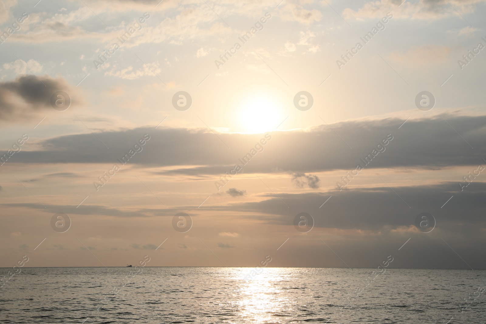 Photo of Picturesque view of sunset with beautiful clouds over sea