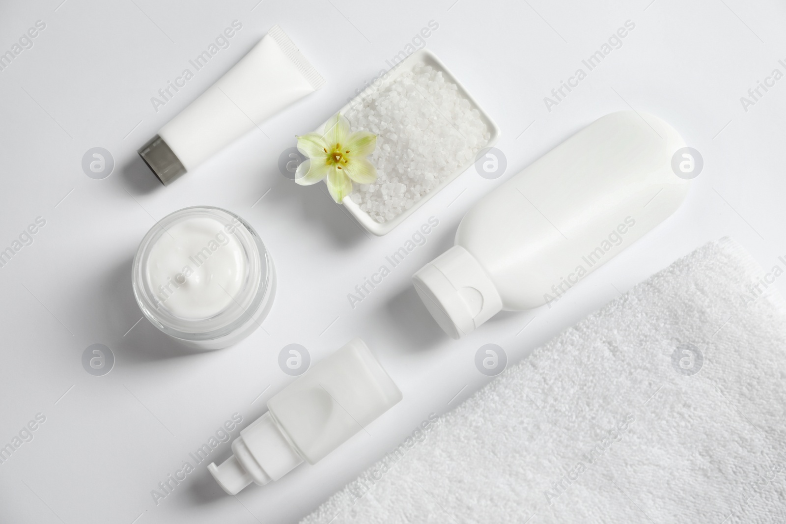 Photo of Flat lay composition with cosmetic products on white background