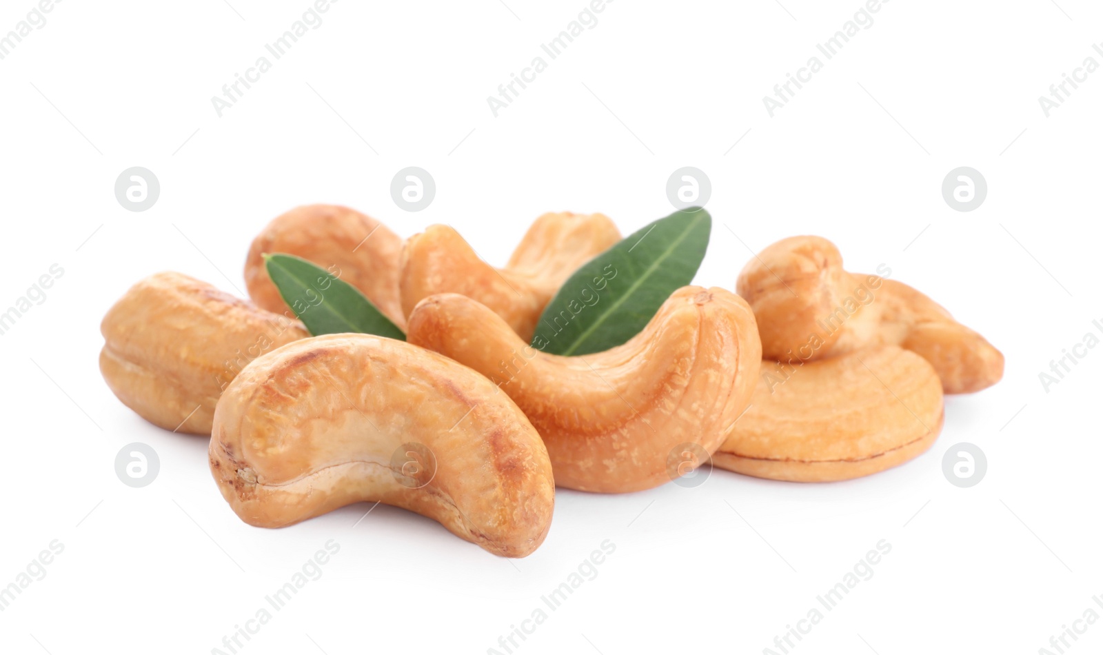 Photo of Pile of tasty organic cashew nuts and green leaves isolated on white