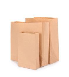 Photo of Paper bags isolated on white. Mockup for design