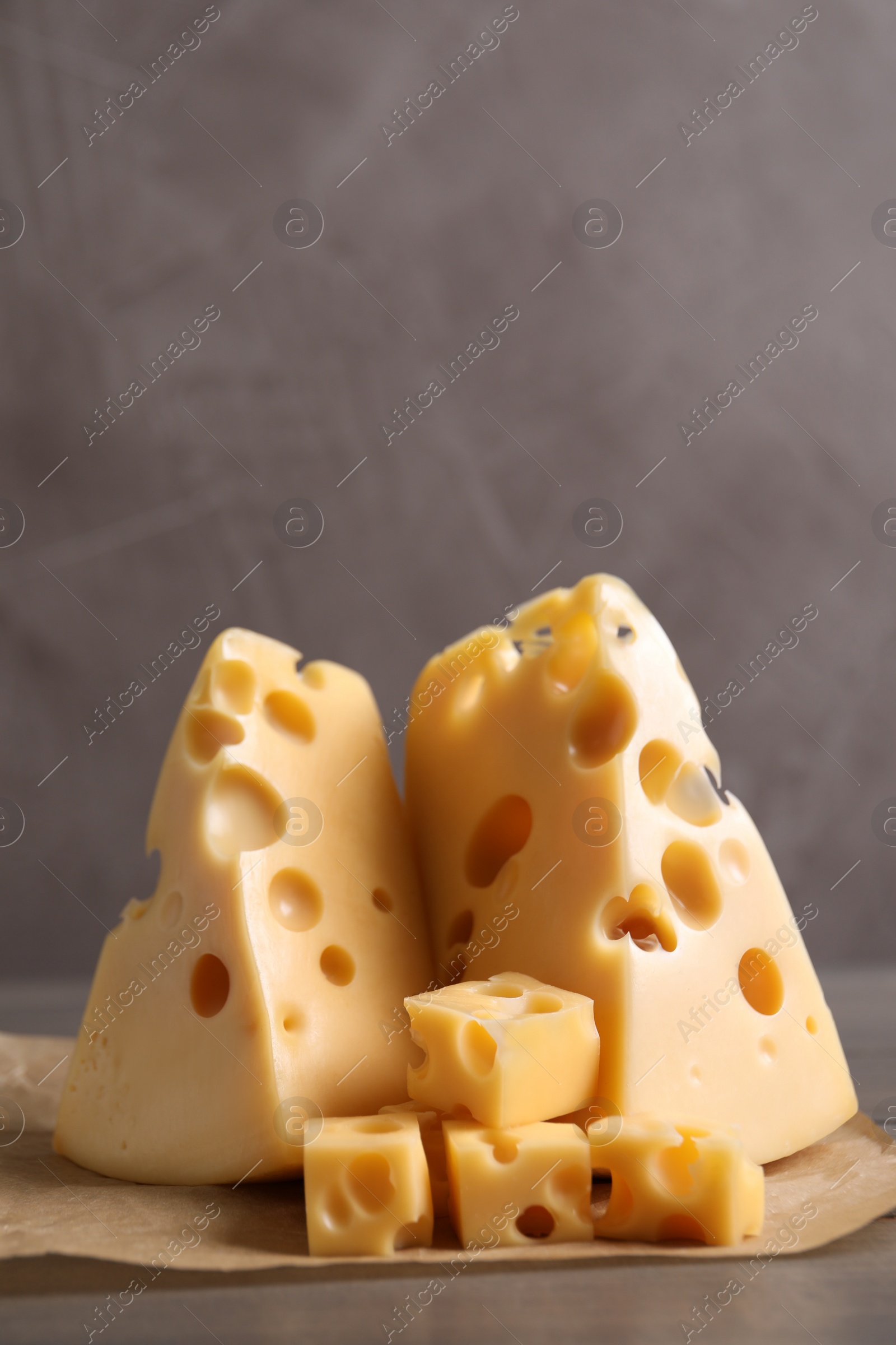 Photo of Tasty fresh cheese on wooden table, closeup