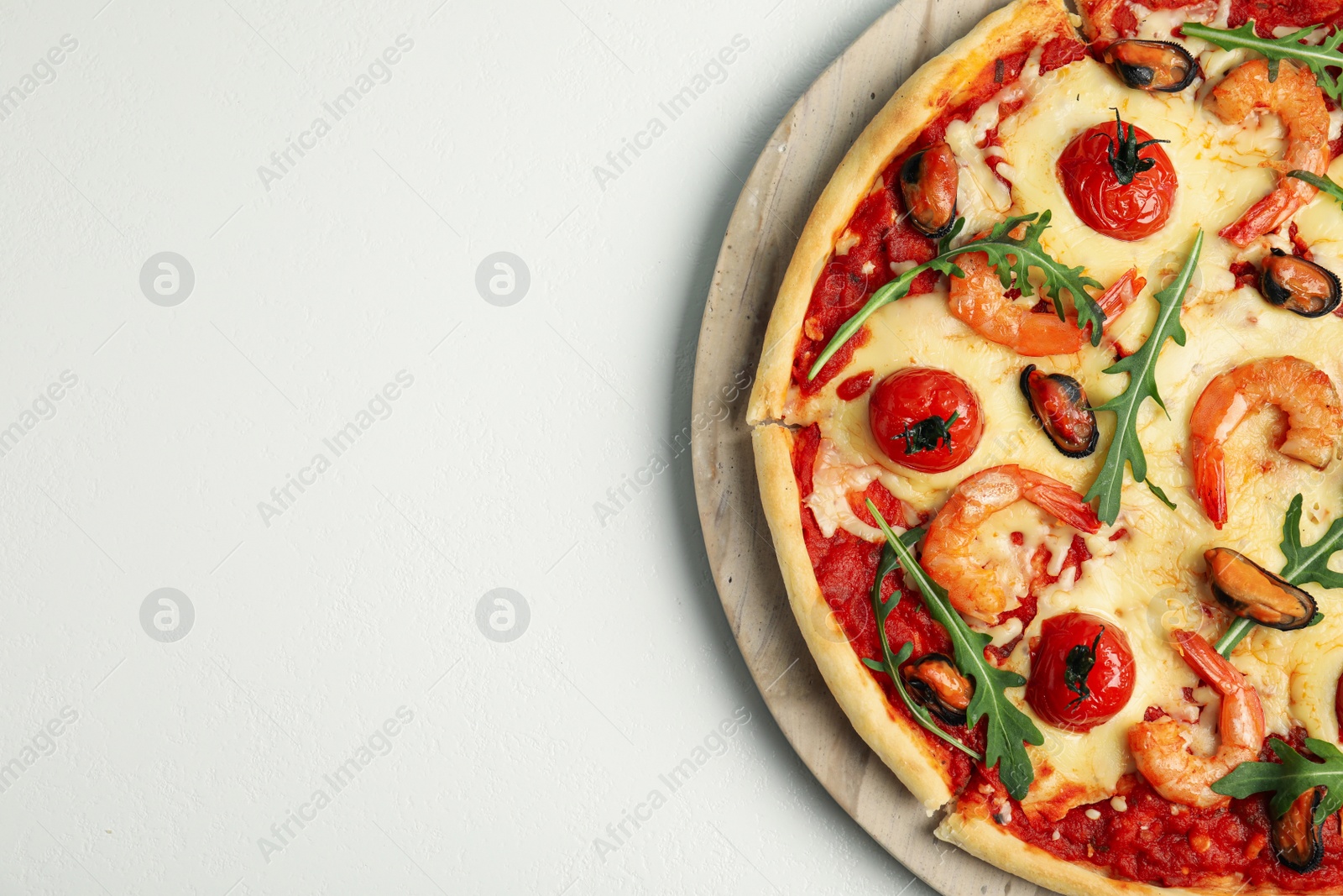 Photo of Delicious seafood pizza on white background, top view