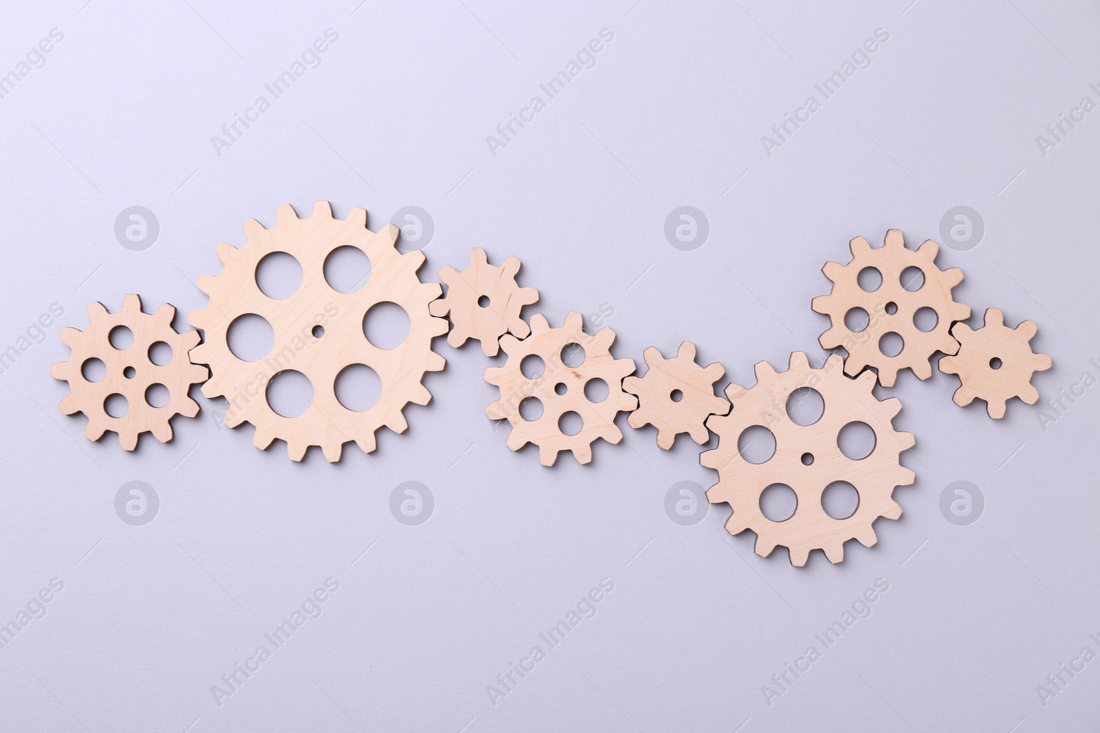 Photo of Business process organization and optimization. Scheme with wooden figures on light background, top view