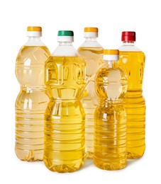 Photo of Bottles of cooking oil on white background