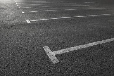 Car parking lot with white marking outdoors