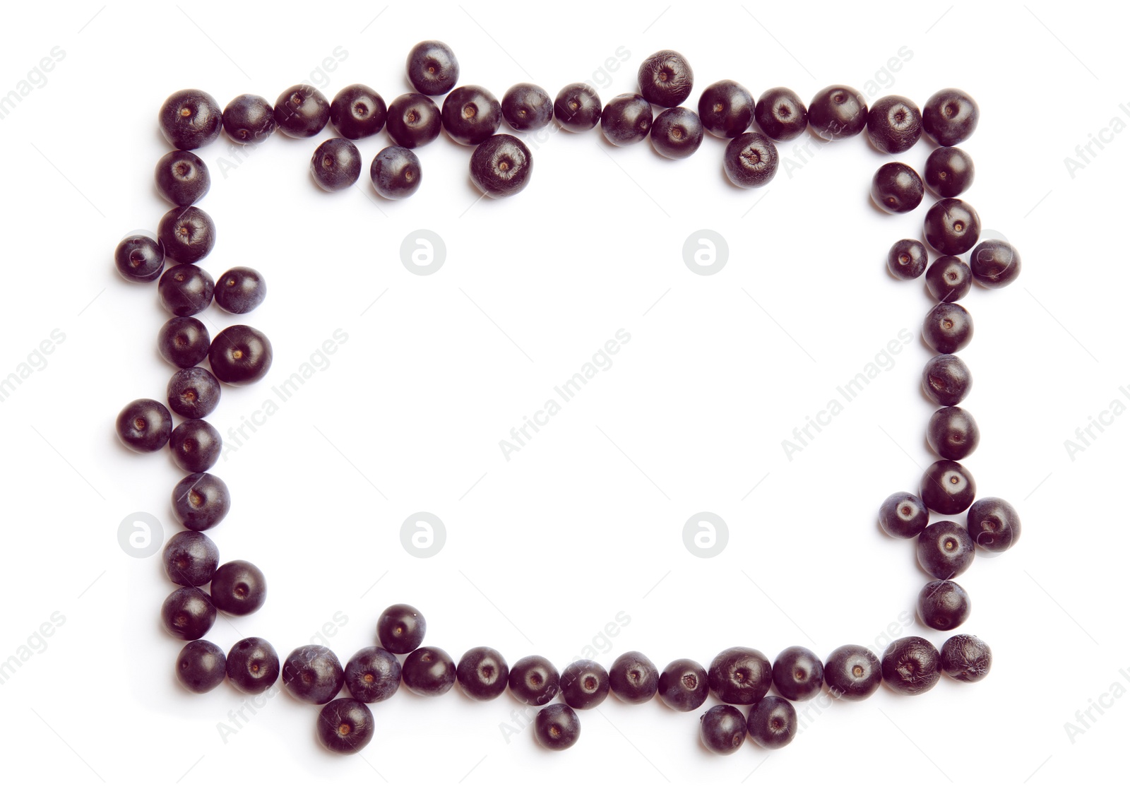 Photo of Frame made of fresh acai berries on white background