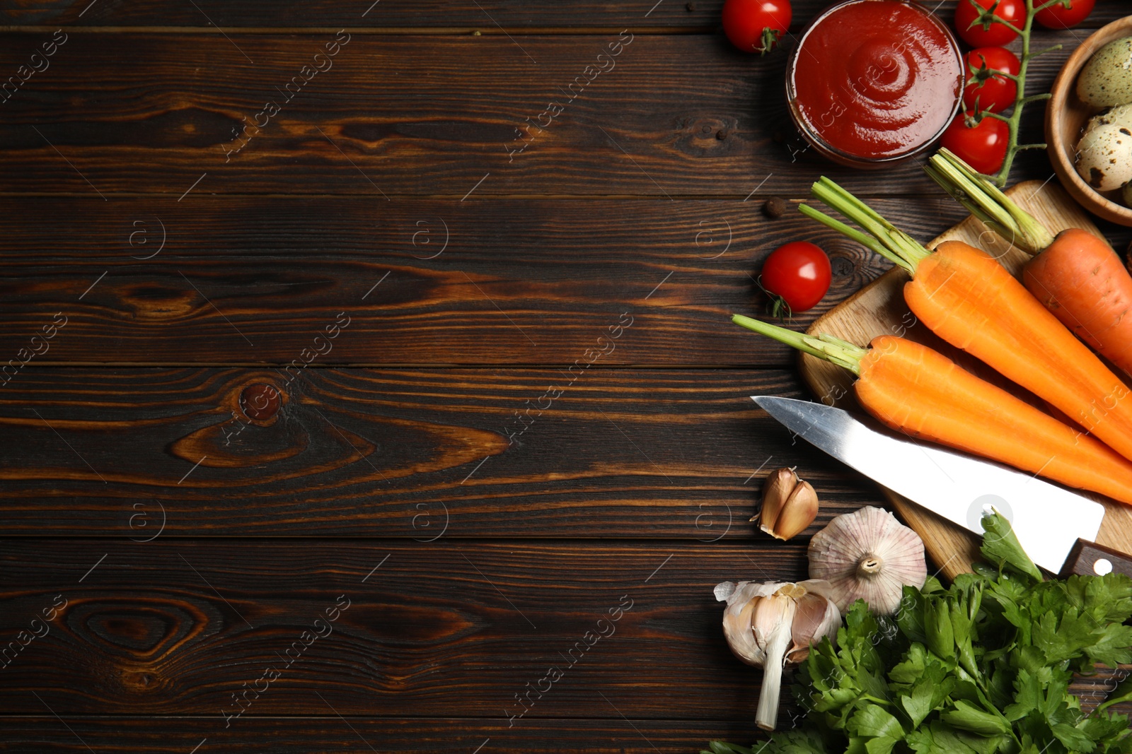 Photo of Flat lay composition with ingredients for cooking on wooden table. Space for text