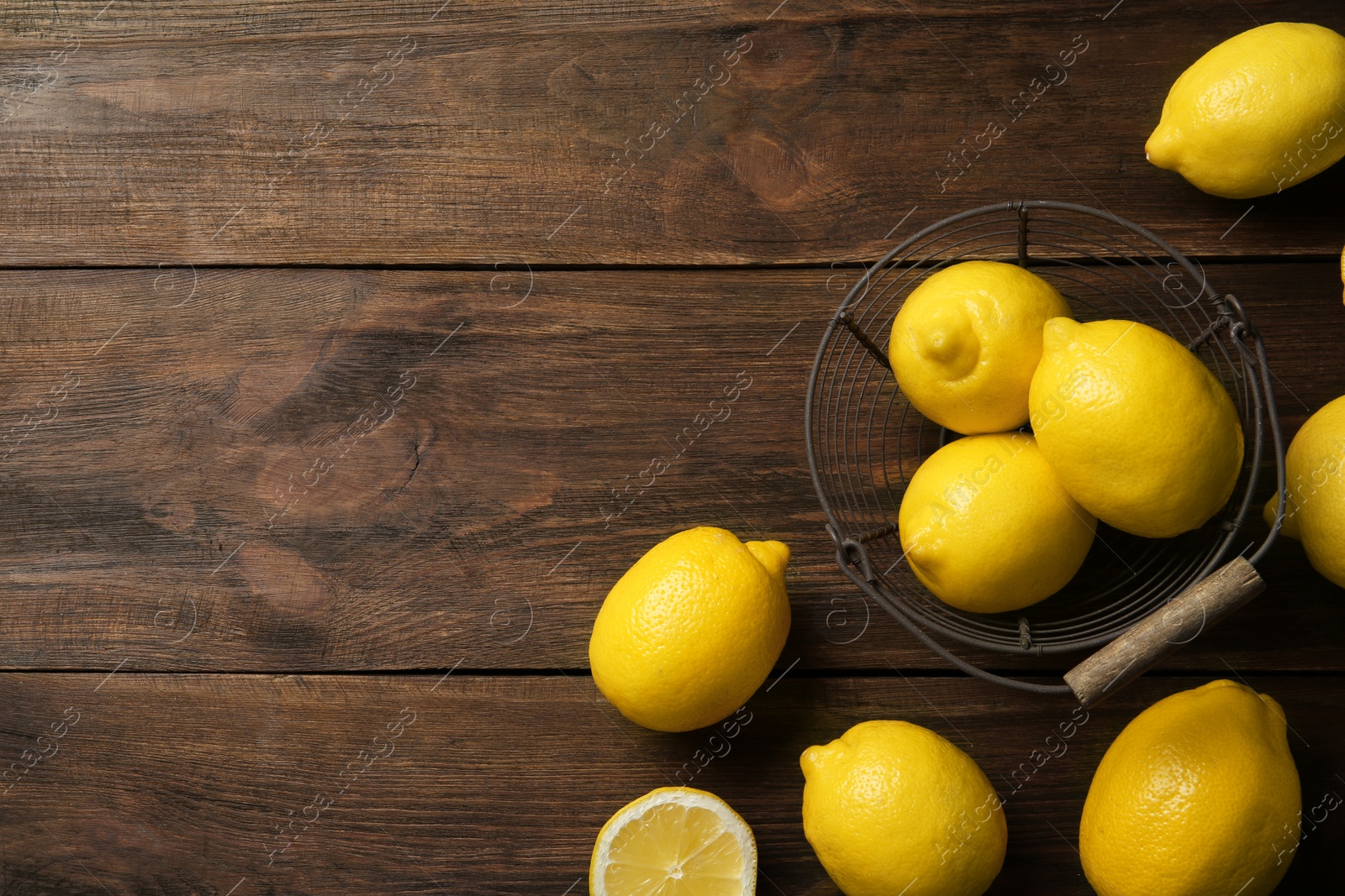 Photo of Flat lay composition with lemons on wooden background