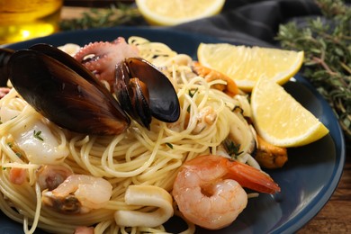 Delicious pasta with sea food on table, closeup