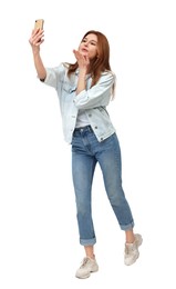 Beautiful woman taking selfie on white background