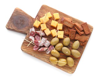 Photo of Toothpick appetizers. Tasty cheese, sausage, croutons and olives on white background, top view
