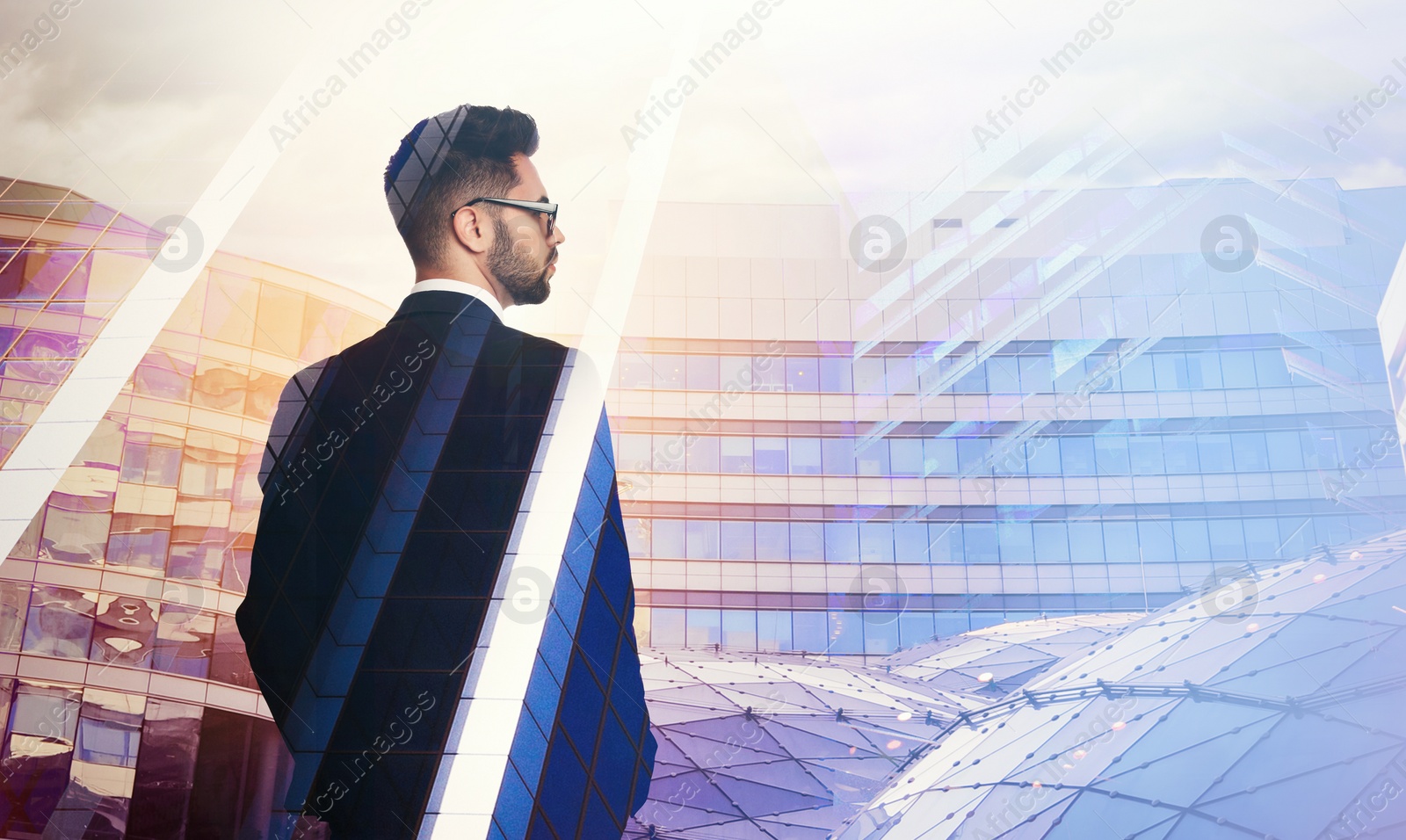 Image of Double exposure of businessman and different buildings in city