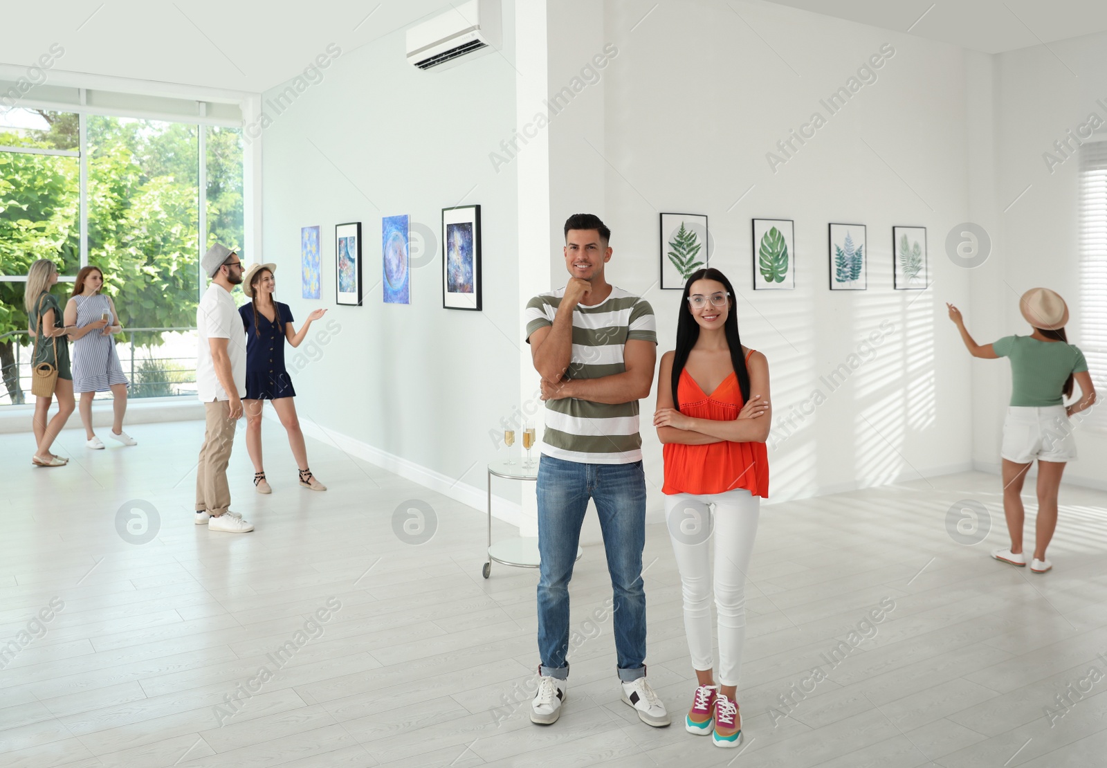 Photo of Happy couple at exhibition in art gallery