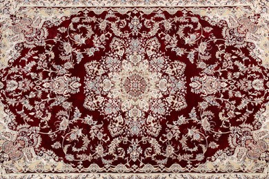 Photo of Soft carpet with beautiful pattern as background, top view