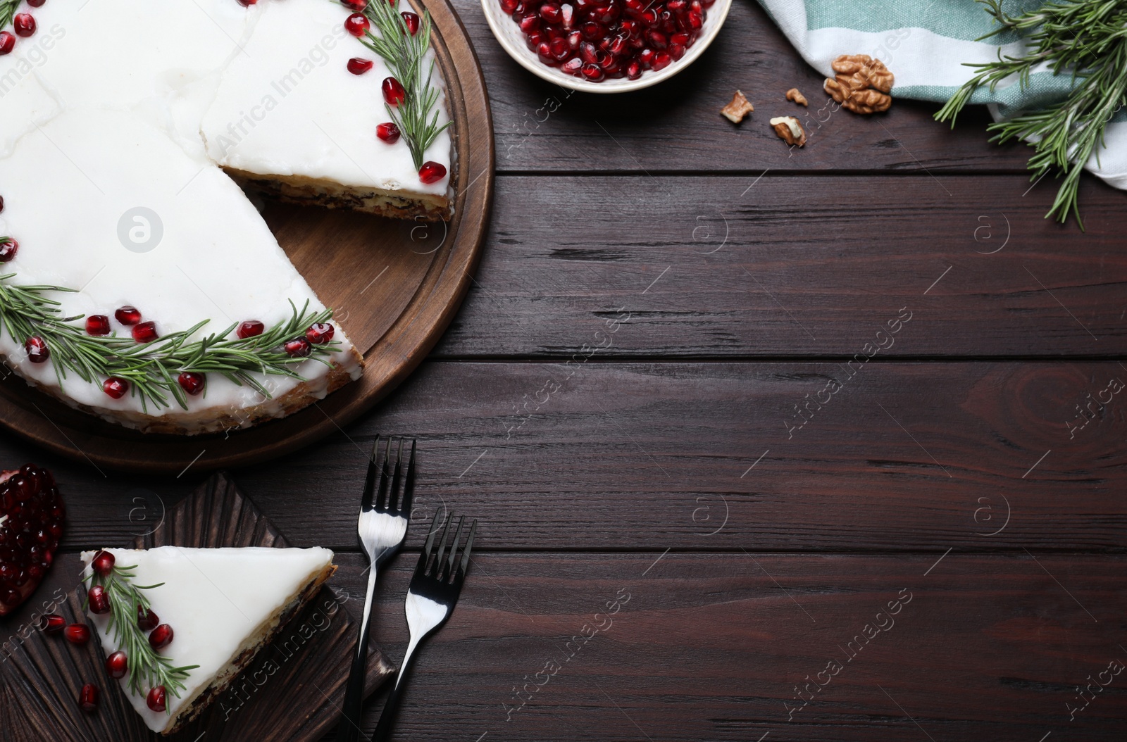 Photo of Traditional homemade Christmas cake served on wooden table, flat lay. Space for text