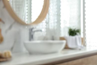 Blurred view of stylish modern bathroom with vessel sink