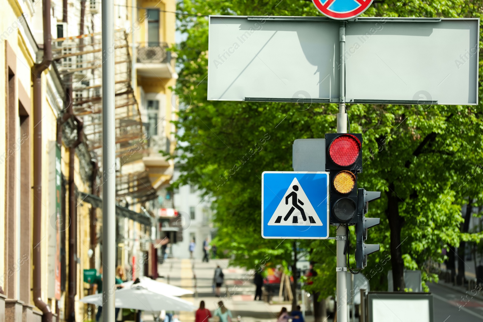 Photo of View of traffic light and sign in city on sunny day