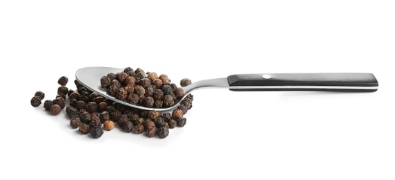 Photo of Spoon of black peppercorns isolated on white
