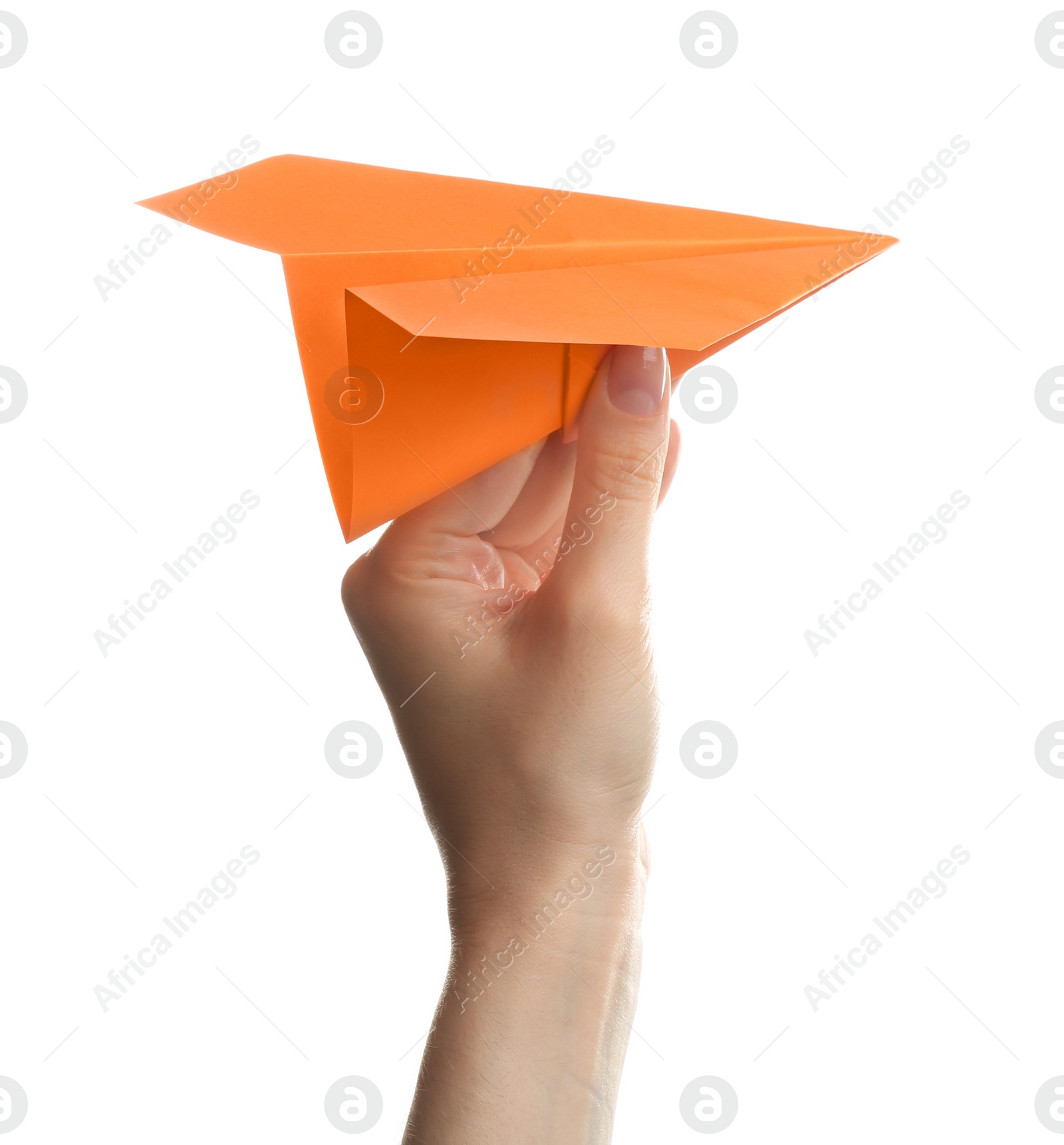 Photo of Woman holding orange paper plane on white background, closeup