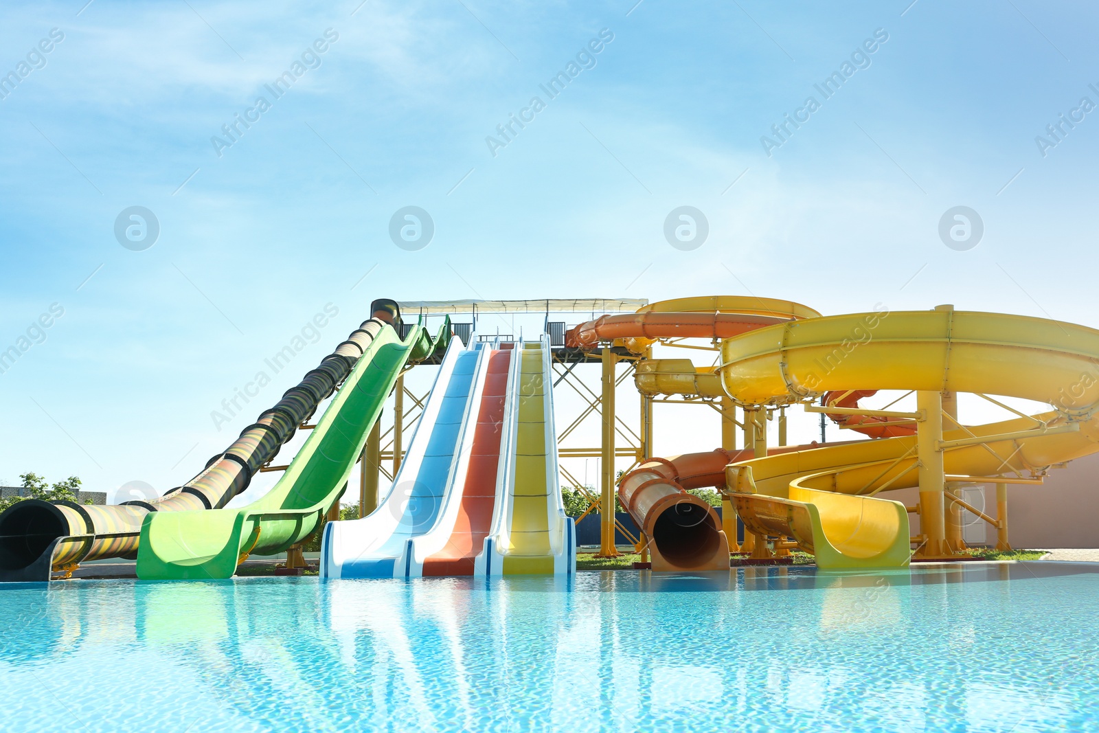 Photo of Different colorful slides in water park on sunny day