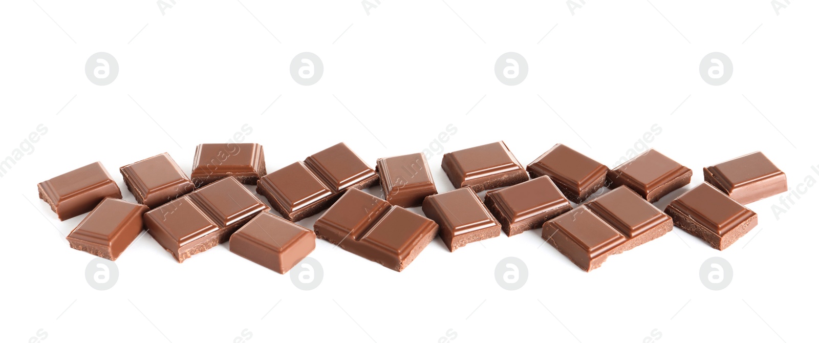Photo of Pieces of tasty milk chocolate on white background
