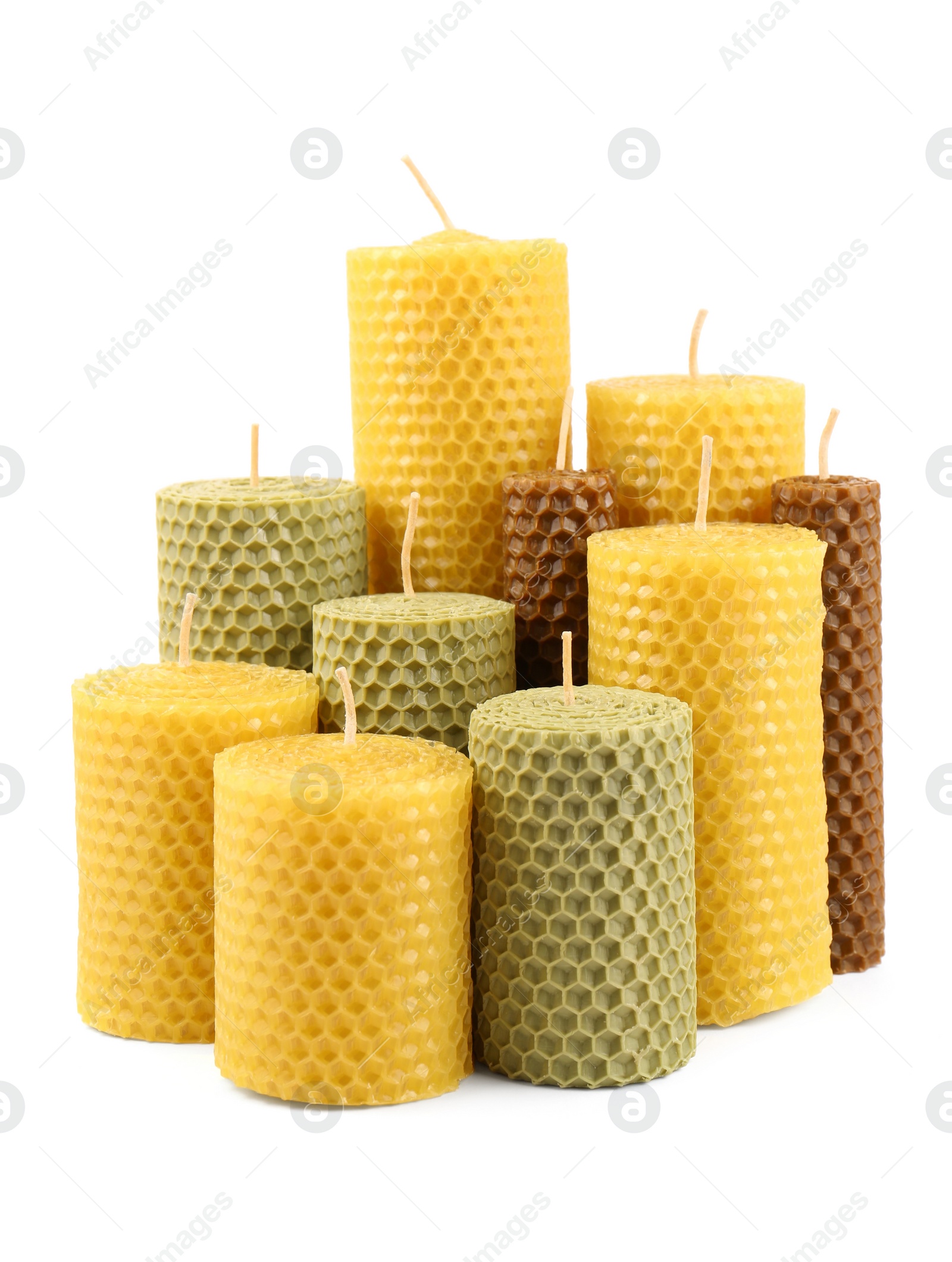 Photo of Stylish elegant beeswax candles isolated on white