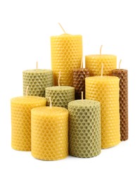 Stylish elegant beeswax candles isolated on white