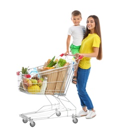 Mother and son with full shopping cart on white background