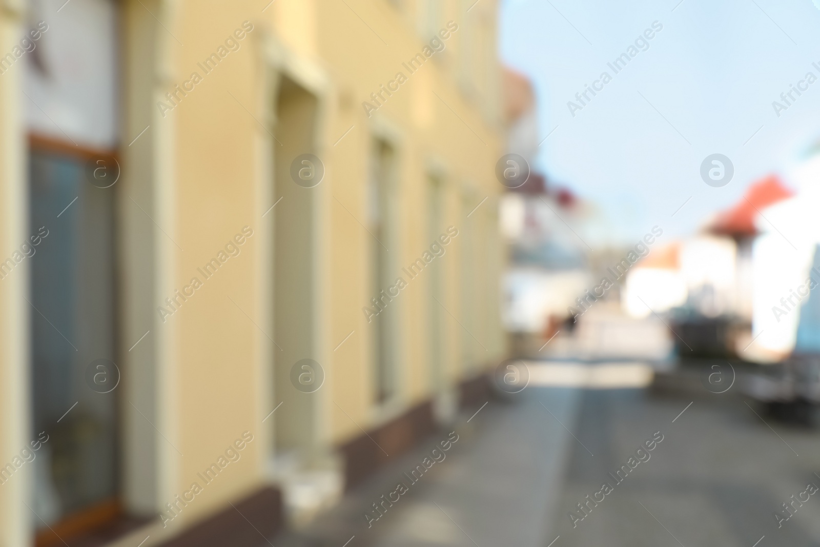 Photo of Blurred view of city street with beautiful building. Bokeh effect