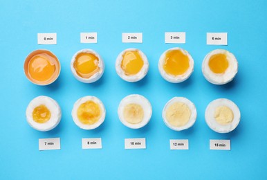 Different cooking time and readiness stages of boiled chicken eggs on light blue background, flat lay