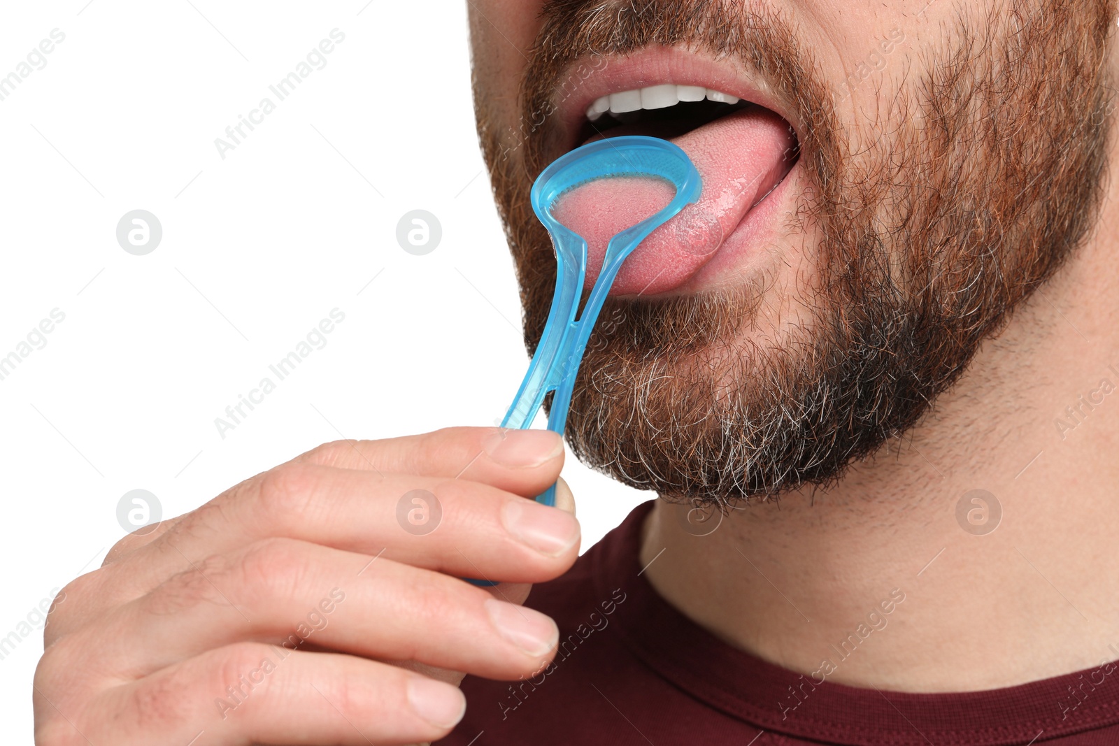 Photo of Man brushing his tongue with cleaner on white background, closeup