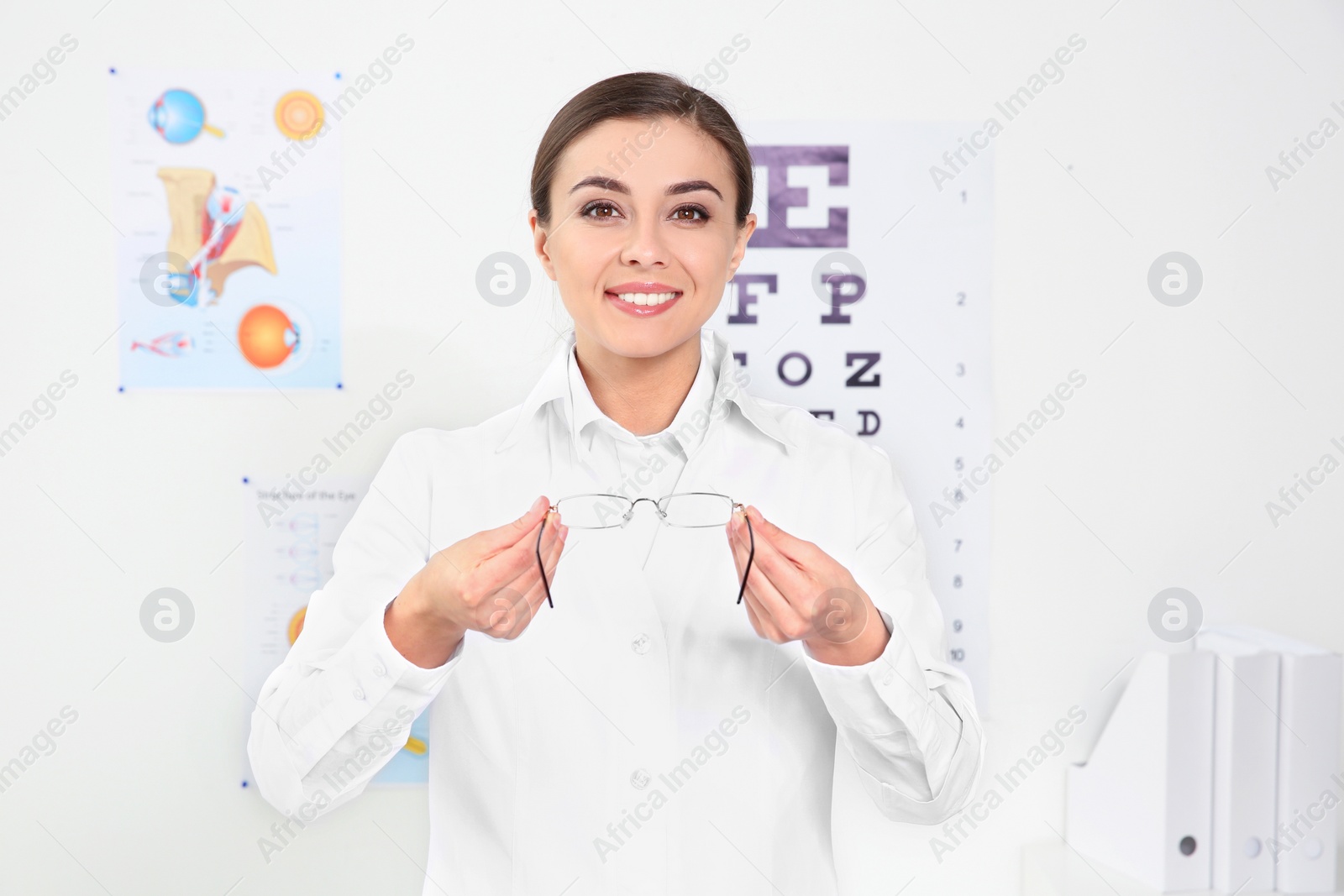 Photo of Female ophthalmologist with glasses in clinic