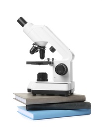 Photo of Microscope and books isolated on white. Medical students stuff
