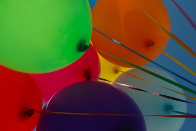 Bright colorful balloons with ribbons, bottom view